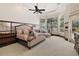 Expansive main bedroom with tray ceiling, bay windows, and luxurious ensuite bath promoting relaxation at 32543 Hawks Lake Ln, Sorrento, FL 32776
