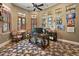 This office features wood floors, a ceiling fan, and ample natural light for a comfortable and productive workspace at 32543 Hawks Lake Ln, Sorrento, FL 32776