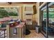 Outdoor kitchen with stainless steel grill, sink, and ample counter space, perfect for entertaining at 32543 Hawks Lake Ln, Sorrento, FL 32776