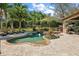 Relaxing pool area featuring a lush tropical landscape, a waterfall spa, and ample space for lounging at 32543 Hawks Lake Ln, Sorrento, FL 32776