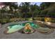 Gorgeous pool and spa surrounded by lush tropical landscaping and ample patio space at 32543 Hawks Lake Ln, Sorrento, FL 32776
