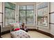 Comfortable seating area in the main bedroom with natural light perfect for reading and relaxing at 32543 Hawks Lake Ln, Sorrento, FL 32776