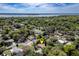 An aerial view of the home and surrounding neighborhood near a large lake at 3430 Laurel Dr, Mount Dora, FL 32757