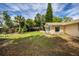 A very spacious and well-maintained backyard with mature trees and lush lawn at 3430 Laurel Dr, Mount Dora, FL 32757