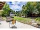 Spacious backyard with patio, well-maintained lawn, storage shed, and mature trees at 3430 Laurel Dr, Mount Dora, FL 32757