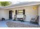 Charming front porch featuring ample seating and decorative elements at 3430 Laurel Dr, Mount Dora, FL 32757