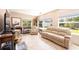 Comfortable living room with reclining chairs and couch set in front of bright windows at 3430 Laurel Dr, Mount Dora, FL 32757