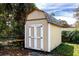 Outdoor storage shed with double doors and a well maintained exterior at 3430 Laurel Dr, Mount Dora, FL 32757
