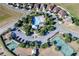Aerial view of community amenities: pool, playground, tennis court, and parking at 3441 Landing Vw, Tavares, FL 32778