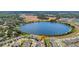 Aerial view of the community and nearby lake. Great community amenities and outdoor activities at 3441 Landing Vw, Tavares, FL 32778