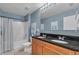 Bathroom featuring double vanity with granite countertops, tiled floors, and tub with shower at 3441 Landing Vw, Tavares, FL 32778
