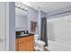 Bathroom featuring a single vanity, a toilet, and a shower with a bathtub at 3441 Landing Vw, Tavares, FL 32778