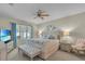 Serene bedroom with a king bed, decorative pillows and bedside tables with lamps at 3441 Landing Vw, Tavares, FL 32778