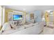 Comfortable living room with a large built-in entertainment center and a plush white sofa at 3441 Landing Vw, Tavares, FL 32778