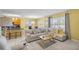 Bright living area featuring a comfortable L-shaped sofa and a view of the kitchen at 3441 Landing Vw, Tavares, FL 32778