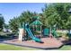Community playground with slides, climbing wall, and various play structures for enjoyment at 3441 Landing Vw, Tavares, FL 32778