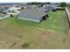 Home with an expansive lawn and a screened patio for enjoying the outdoors at 3532 Thorne Path, Oxford, FL 34484