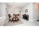 View of the dining area with chandelier, piano, and tiled floors at 3532 Thorne Path, Oxford, FL 34484