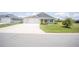 Inviting home with a well-maintained lawn and a spacious driveway at 3532 Thorne Path, Oxford, FL 34484