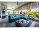 Inviting screened lanai featuring comfortable seating, stylish decor, and lush greenery for ultimate relaxation and outdoor enjoyment at 3532 Thorne Path, Oxford, FL 34484