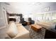 Open-concept living area with plenty of natural light and stylish furnishings at 3532 Thorne Path, Oxford, FL 34484
