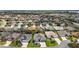 Wide aerial view of a neighborhood showcasing rooftops, landscaping, and community layout at 3537 Cluster Ct, The Villages, FL 32163