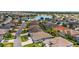 Aerial view of a residential neighborhood with a lake at 3537 Cluster Ct, The Villages, FL 32163