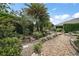 Beautiful backyard landscaping with decorative stone design at 3537 Cluster Ct, The Villages, FL 32163