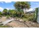 Backyard garden with stone bridge and beautiful landscaping at 3537 Cluster Ct, The Villages, FL 32163