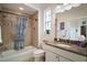 Bathroom featuring a shower with a shower curtain and a vanity with granite countertops at 3537 Cluster Ct, The Villages, FL 32163