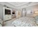 Comfortable bedroom featuring a coffered ceiling and an entertainment center at 3537 Cluster Ct, The Villages, FL 32163