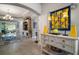 Inviting entryway with a console table, and a glimpse into the adjacent living area at 3537 Cluster Ct, The Villages, FL 32163