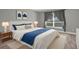 Bedroom features a comfortable bed with bright natural light from the large window at 36700 Oconee Ave, Eustis, FL 32736