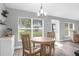 Eat-in kitchen dining area features a wood table, natural lighting, and outdoor views at 36700 Oconee Ave, Eustis, FL 32736