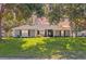 Inviting single-Gathering home with neatly trimmed lawn and decorative gray paint scheme at 36700 Oconee Ave, Eustis, FL 32736