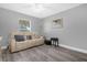 Cozy living room with a comfortable sofa, a small table, and soothing decor at 36700 Oconee Ave, Eustis, FL 32736