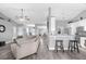 Spacious open-concept living area featuring a breakfast bar and view of the kitchen at 36700 Oconee Ave, Eustis, FL 32736