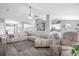 Bright and airy living room featuring a comfortable sectional sofa and modern decor at 36700 Oconee Ave, Eustis, FL 32736