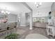 Open-concept living and dining area, featuring modern decor and wood-look flooring at 36700 Oconee Ave, Eustis, FL 32736