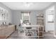 Bright home office features a modern desk and shelving unit with lots of natural light from the window at 36700 Oconee Ave, Eustis, FL 32736