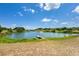 Picturesque pond with a charming dock and a fountain, creating a tranquil and scenic setting at 36700 Oconee Ave, Eustis, FL 32736