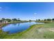 Beautiful view of a tranquil pond surrounded by lush greenery on a clear day at 36700 Oconee Ave, Eustis, FL 32736