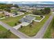 Overhead view of the property showcasing the expansive lawn, two car garage, and a welcoming front porch at 395 S Dixie Dr, Howey In The Hills, FL 34737