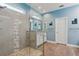 Modern bathroom features a glass shower, tile accents, and vanity with granite countertop at 395 S Dixie Dr, Howey In The Hills, FL 34737