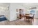 Dining area with wood floors, a decorative chandelier, and classic wood furniture at 395 S Dixie Dr, Howey In The Hills, FL 34737
