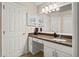 Bathroom featuring granite counters, ample vanity space, and bright lighting at 4087 Capland Ave, Clermont, FL 34711