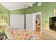Bright bedroom featuring a window, cheerful wall color, and convenient closet space at 4087 Capland Ave, Clermont, FL 34711