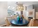 Charming dining room featuring a round table and chairs with a view into the kitchen at 4087 Capland Ave, Clermont, FL 34711