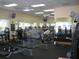 Well-equipped exercise room with modern fitness equipment, ceiling fans, and large windows for natural light at 4087 Capland Ave, Clermont, FL 34711