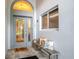 Inviting front porch with stylish seating, decor pillows, a 'hello' mat, and decorative front door at 4087 Capland Ave, Clermont, FL 34711